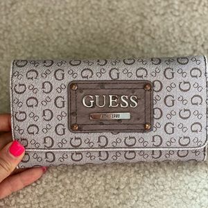 Guess wallet, brown, good condition, no rips.